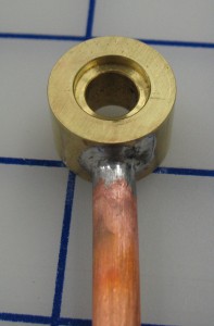 The top connector before installation on the caster, showing one of the counterbores for the O-rings.