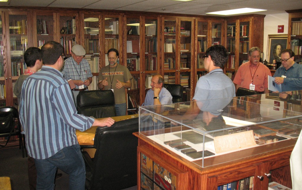 Xxxx showing some of his Cherokee type casting items at the Romano Library.