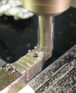 Surface milling the part to get it near the correct thickness.