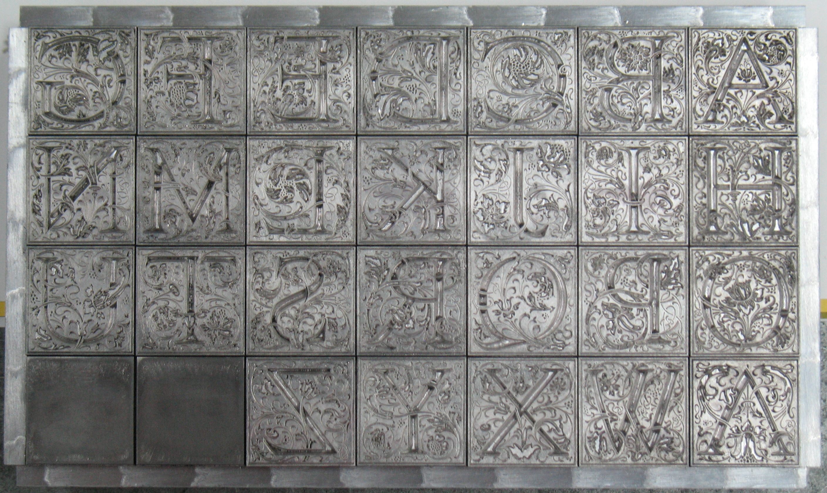 60-point Goudy Cloister Initials. The extra types are supposed to be tint blocks but their matrices were in poor shape and they did not turn out very well. Clearly I have to do a better job of cleaning my type after proofing these.